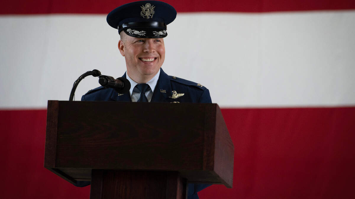 U.S. Air Force Col. John Poole, 375th Air Mobility Wing commander, addresses the crowd in attendance after assuming command of the 375th AMW on Scott Air Force Base, Illinois, July 14, 2023. Poole previously served as the 317th Operations Group commander at Dyess Air Force Base, Texas. (U.S. Air Force photo by Staff Sgt. Dalton Williams )