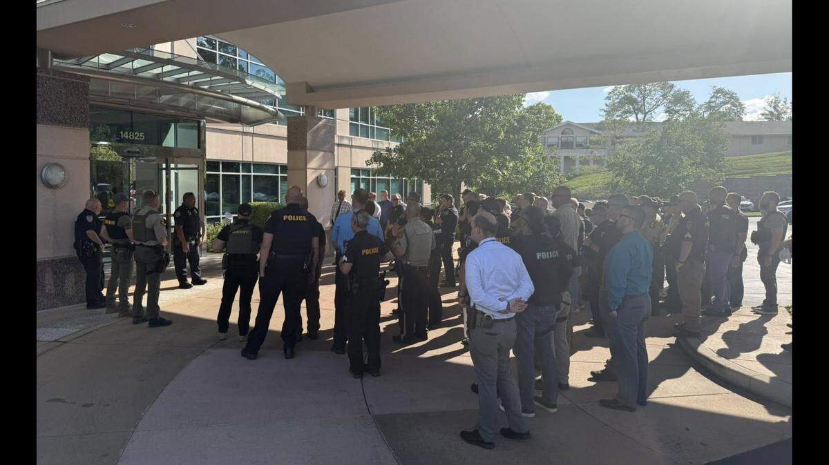 Police officers from multiple agencies gathered outside Barnes-Jewish Hospital in St. Louis, awaiting discharge of Fairview Heights Police Officer Herminio “Tony” Raimundi, who is one of five officers injured responding to a domestic disturbance Saturday. Raimundi, who had a bone in his arm broken by a bullet, was taken home by police escort Tuesday.