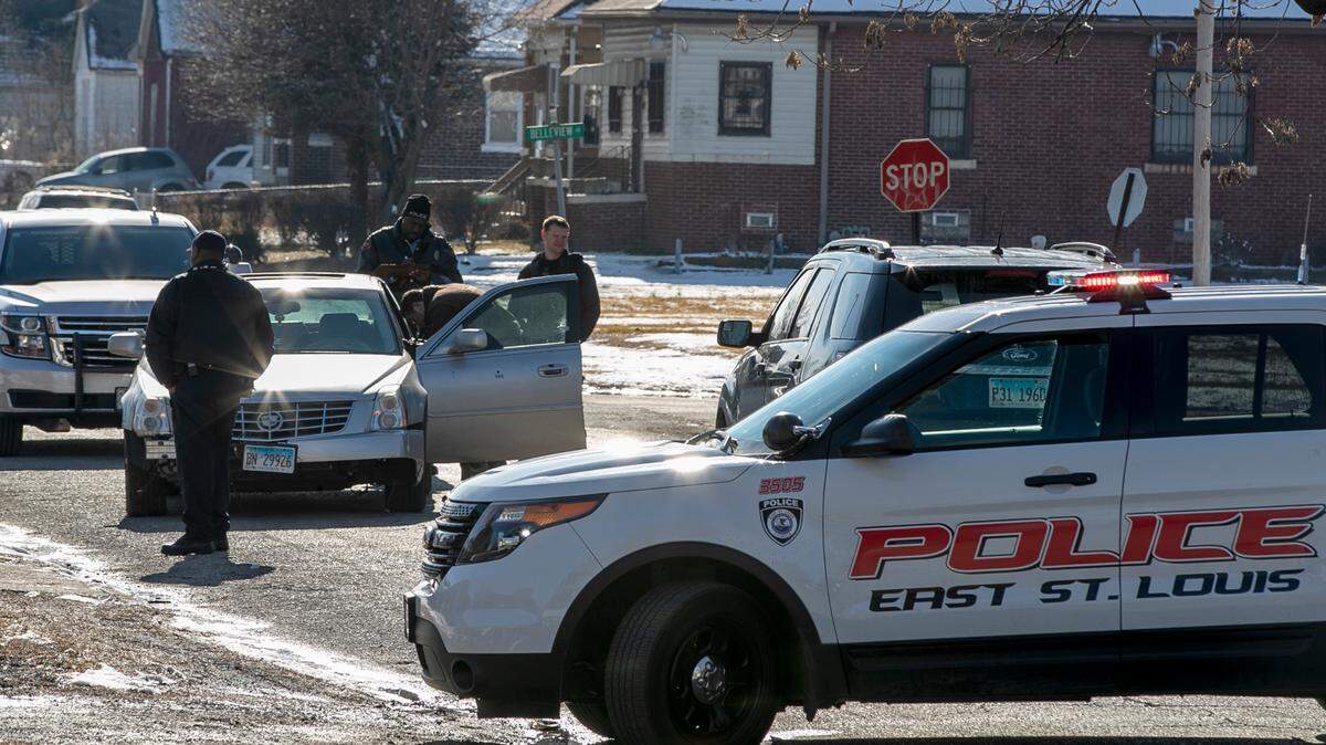 Police investigate a crime scene on 24th St at Belleview Ave. in East St. Louis Friday afternoon.