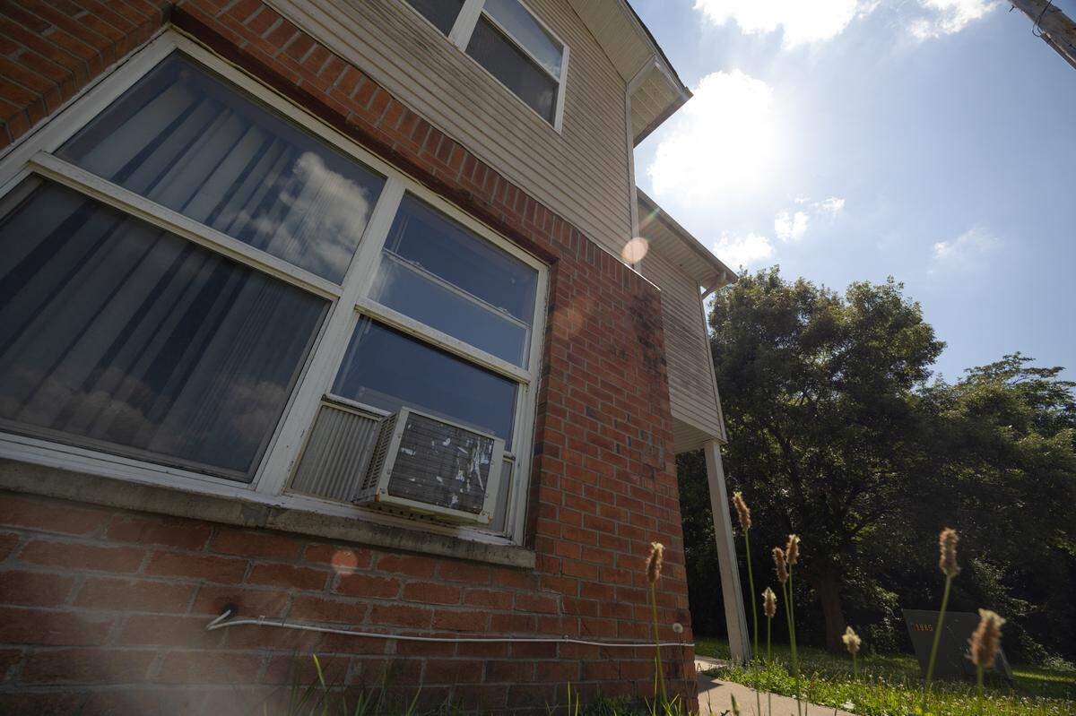 A window air conditioning unit is shown at an apartment at Centreville Courts in Cahokia Heights.