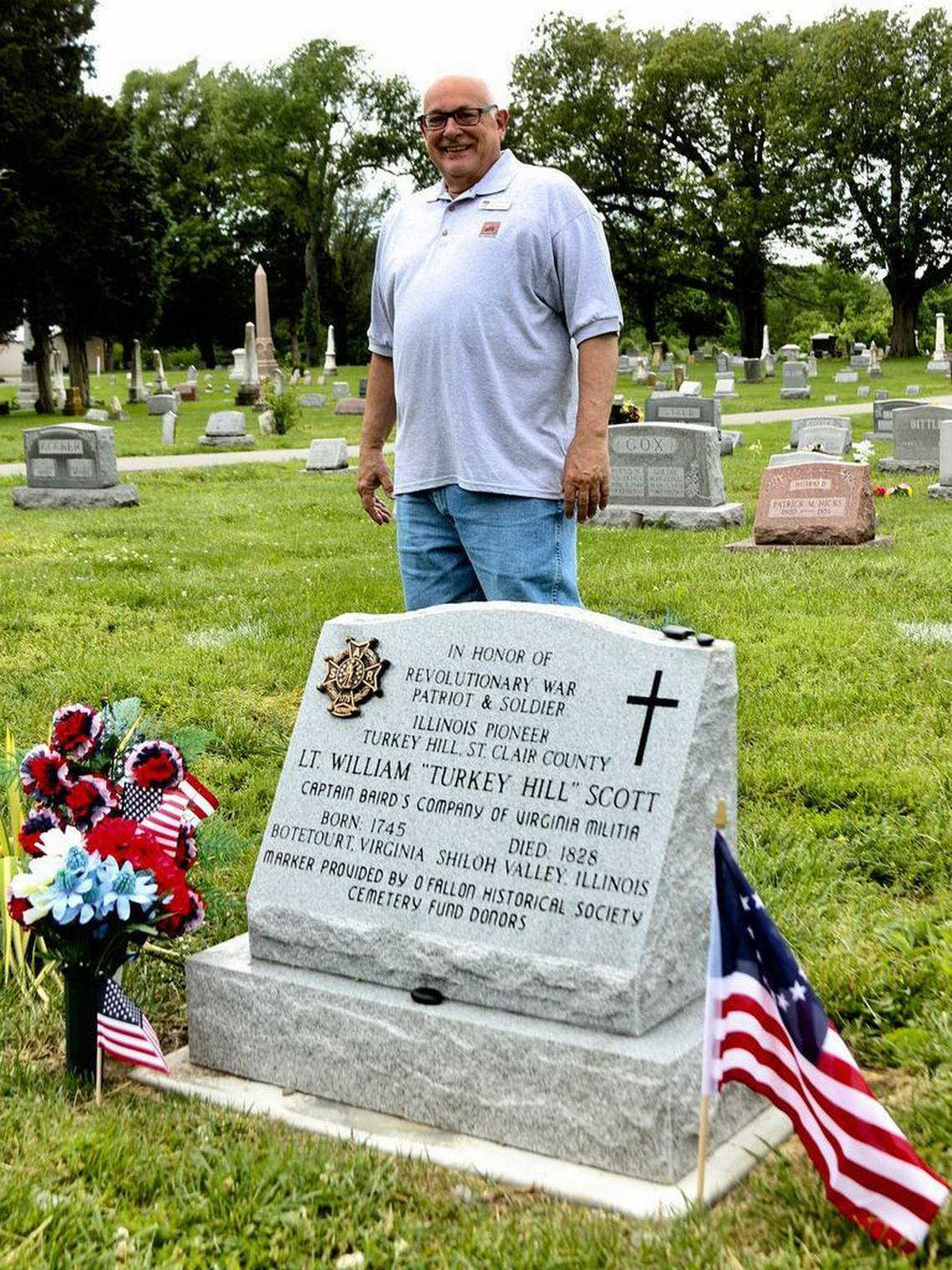 Tom Schwarztrauber at one of the restored grave stones. Schwarztrauber founded Cemetery Detectives, a group who traverses St. Clair, Madison, Monroe and Randolph counties, hunting for ancestral burial grounds and discovering local history on their excursions.