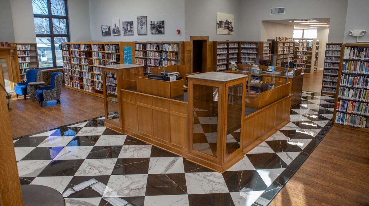 A marble-look flooring was installed at the main entrance of Louis Latzer Library in Highland reminiscent of the original black and white tile.