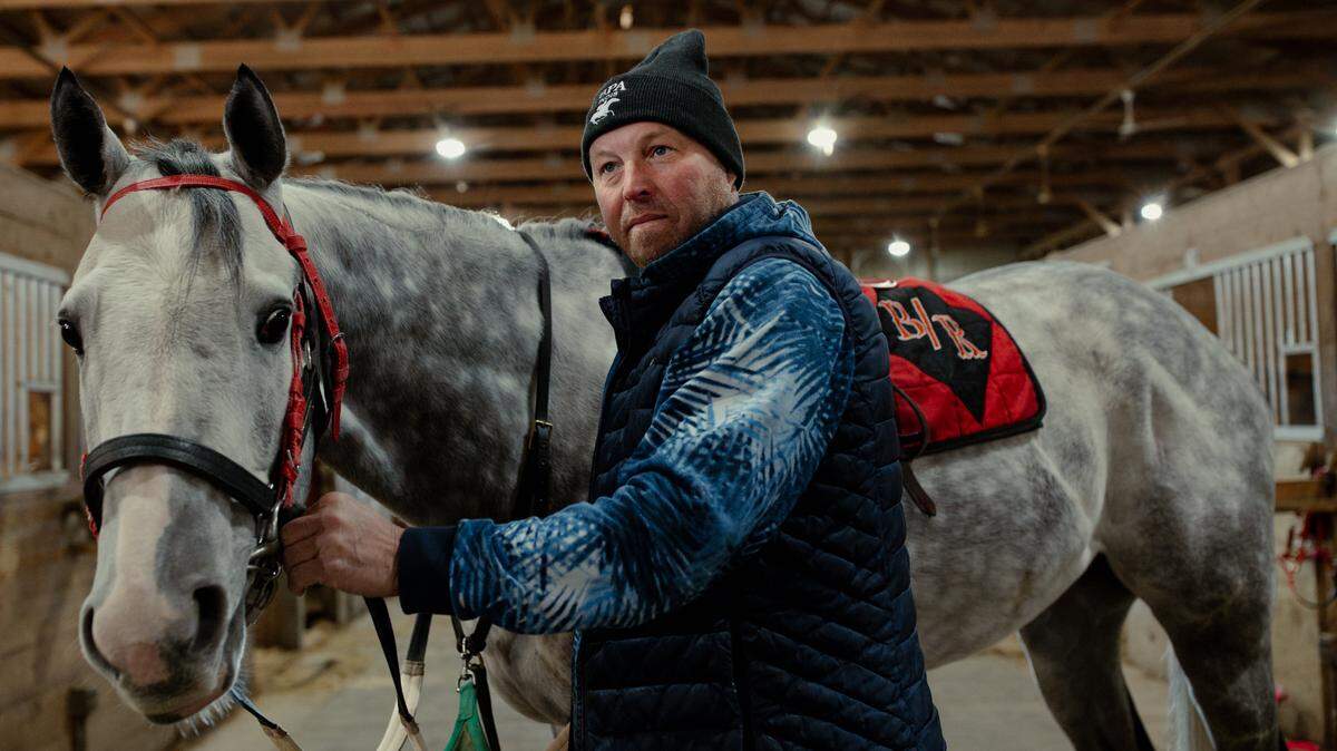 Horse trainer and breeder Scott Becker alongside Wildwood Sicilian, a 6-year-old thoroughbred horse, on Thursday, March 6, 2025, at Fairmount Park in Collinsville.