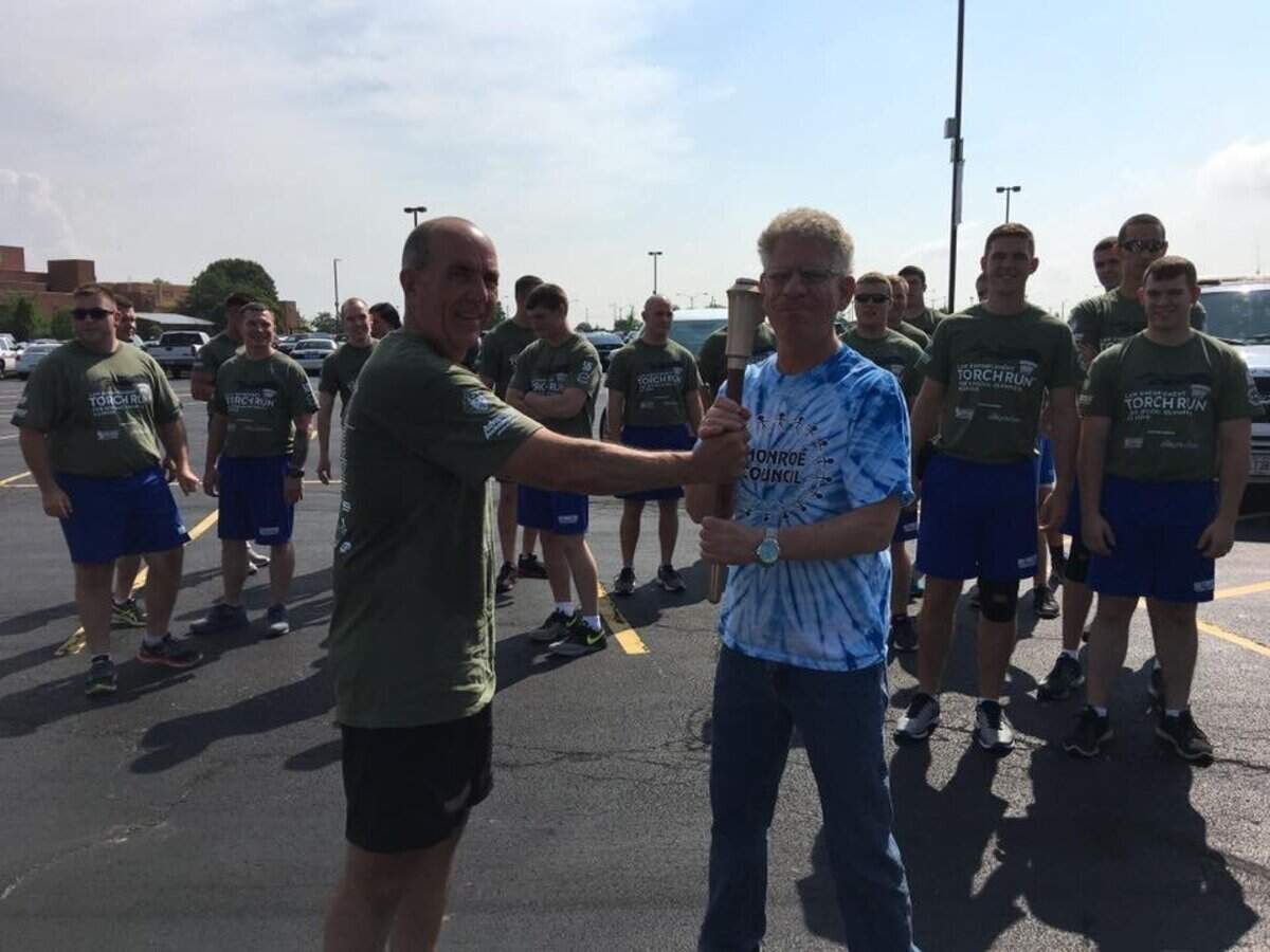 One of Coach Mike Kuhlmann’s favorite memories was running with the Summer 2017 Special Olympics tourch, his coach Debi Heck said.