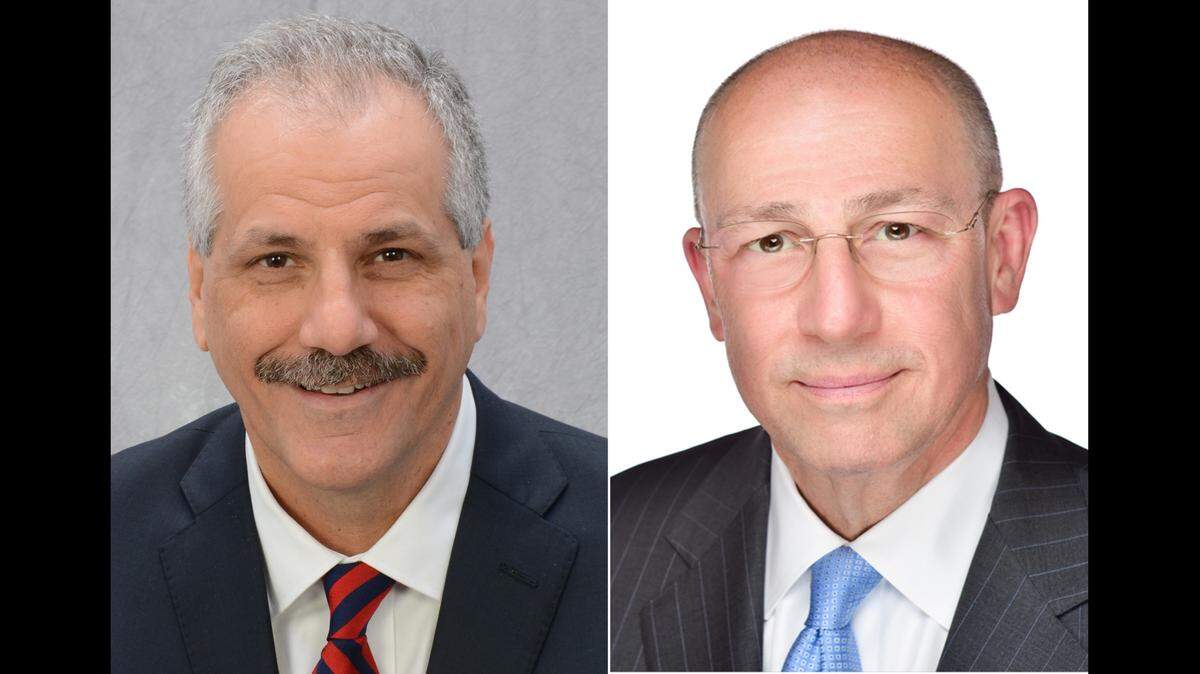 Mark J. Turner, left, is president of Memorial Regional Health Services. Dr. Timothy J. Eberlein is director of Siteman Cancer Center.