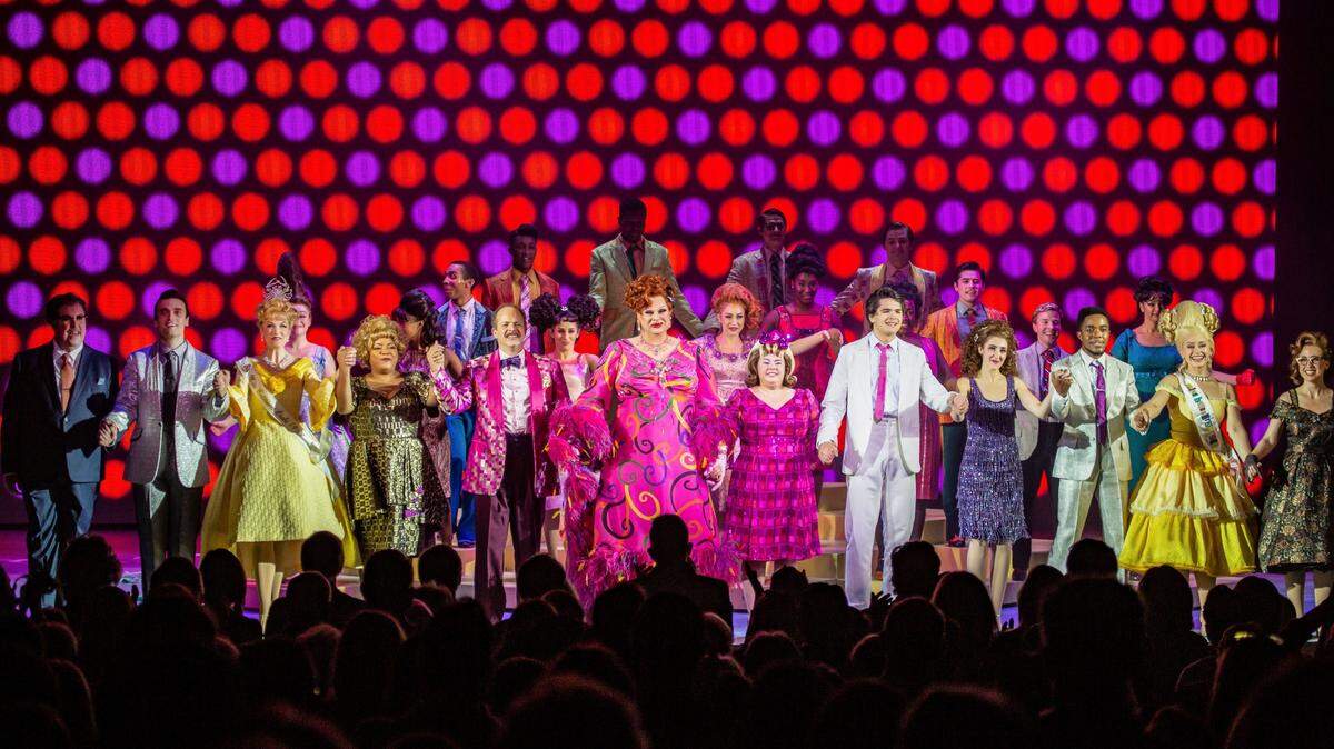 Kaelee Albritton, 2014 Miss O’Fallon and 2015 OTHS graduate, will take the stage at the Fox Theater 527 N. Grand Blvd., St. Louis, through Saturday, April 9, in the national tour of “Hairspray” playing the role of Amber Von Tussle. Pictured is a curtain call with the cast of “Hairpray” on tour — Albritton is second from right.