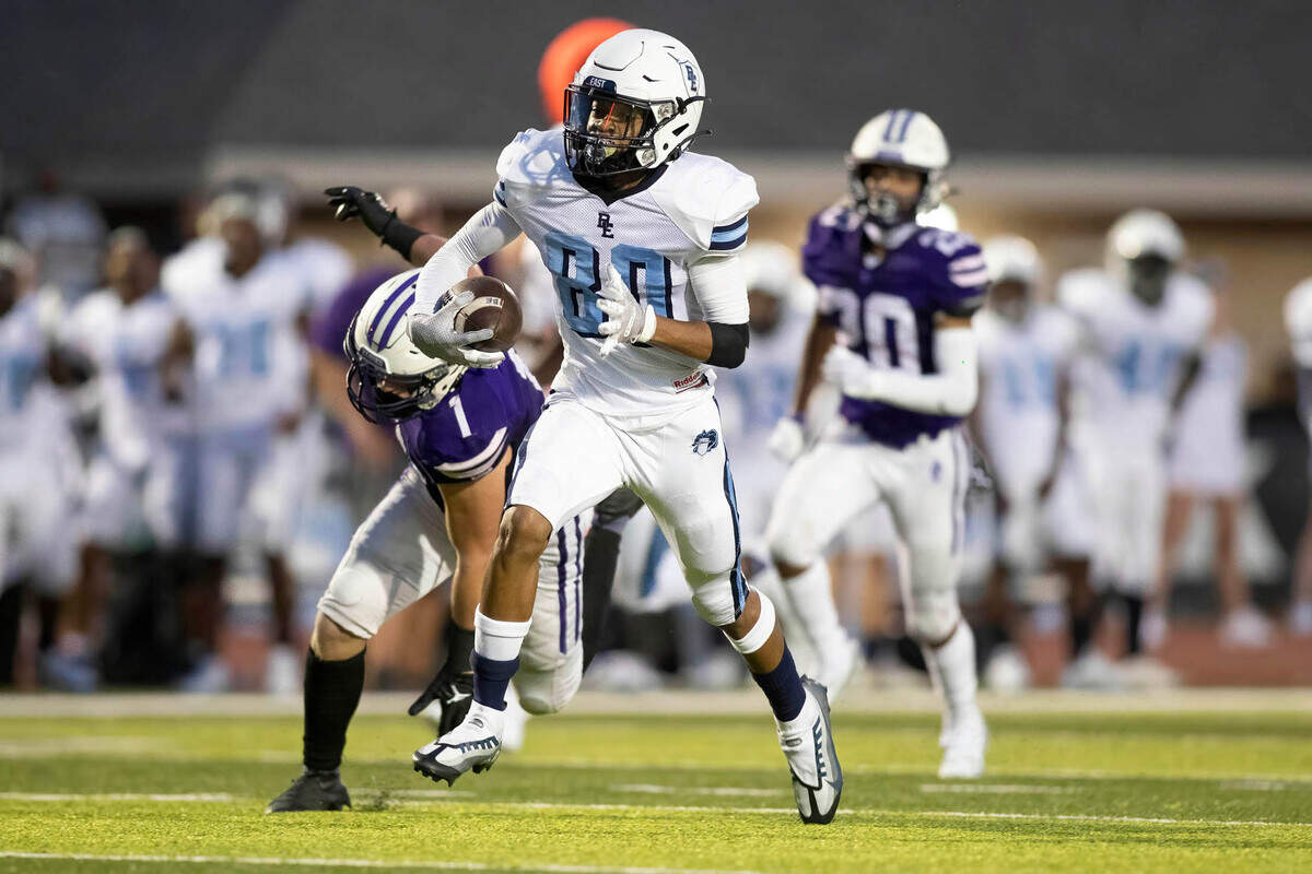 Belleville East’s Justin Spears breaks into open field for a touchdown during Friday night’s season opener against Collinsville. The Lancers ultimately prevailed 20-12.