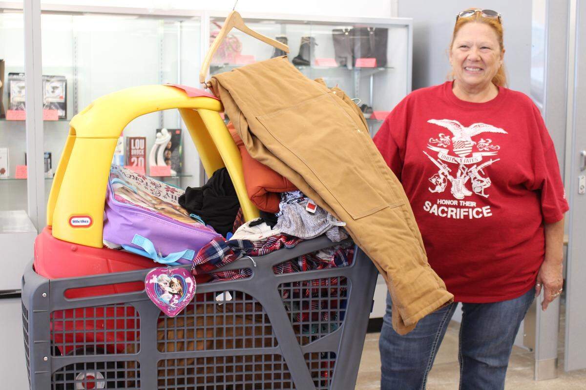 Marissa resident Becky Wisdom left the new Goodwill store in Belleville on Friday with a cartful of treasures, including Christmas presents for family members.
