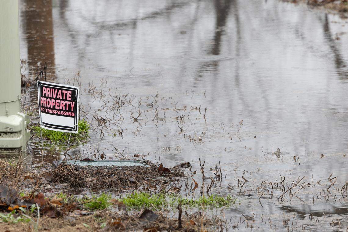 Water pools on the ground during a March 5 rainstorm in Cahokia Heights. Decades-long infrastructure issues in the community cause sewage to spill from city pipes and flood into streets, yards and homes during heavy rain.