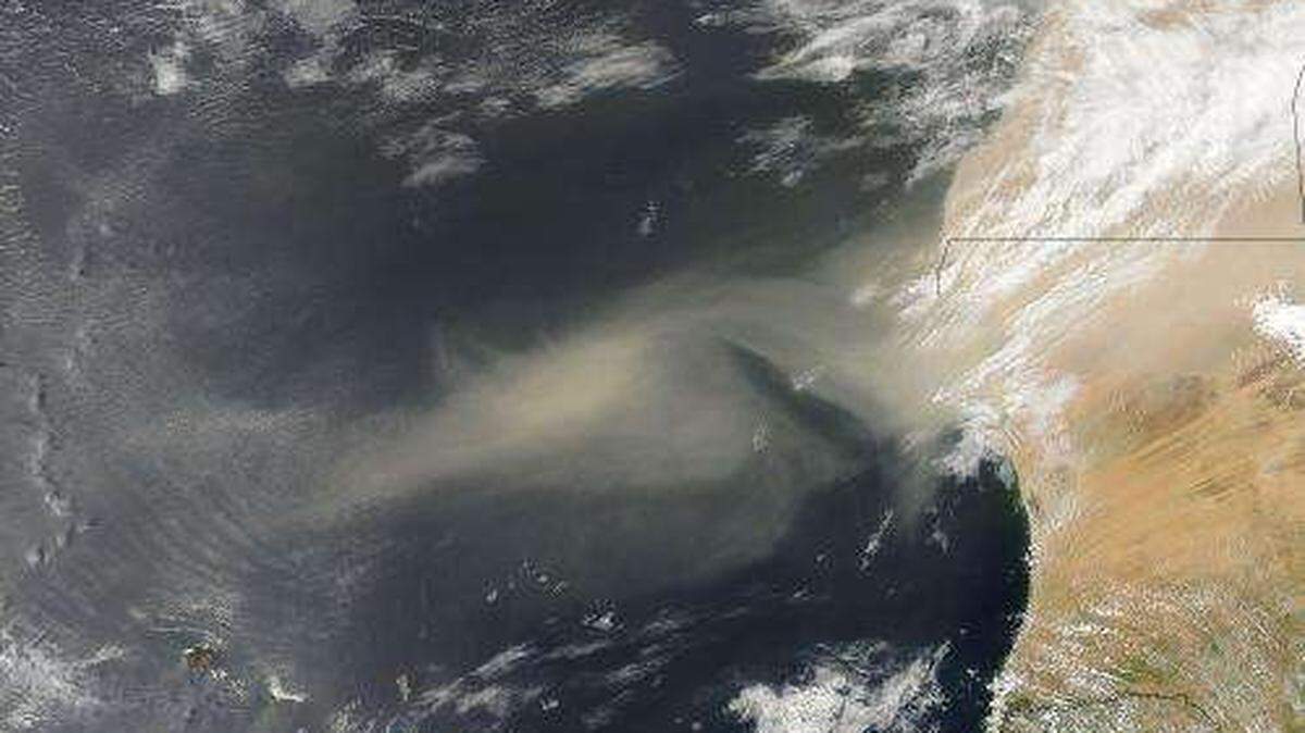 A NASA satellite image from 2013 shows a cloud of dust carried by strong winds from sources in the Western Sahara.