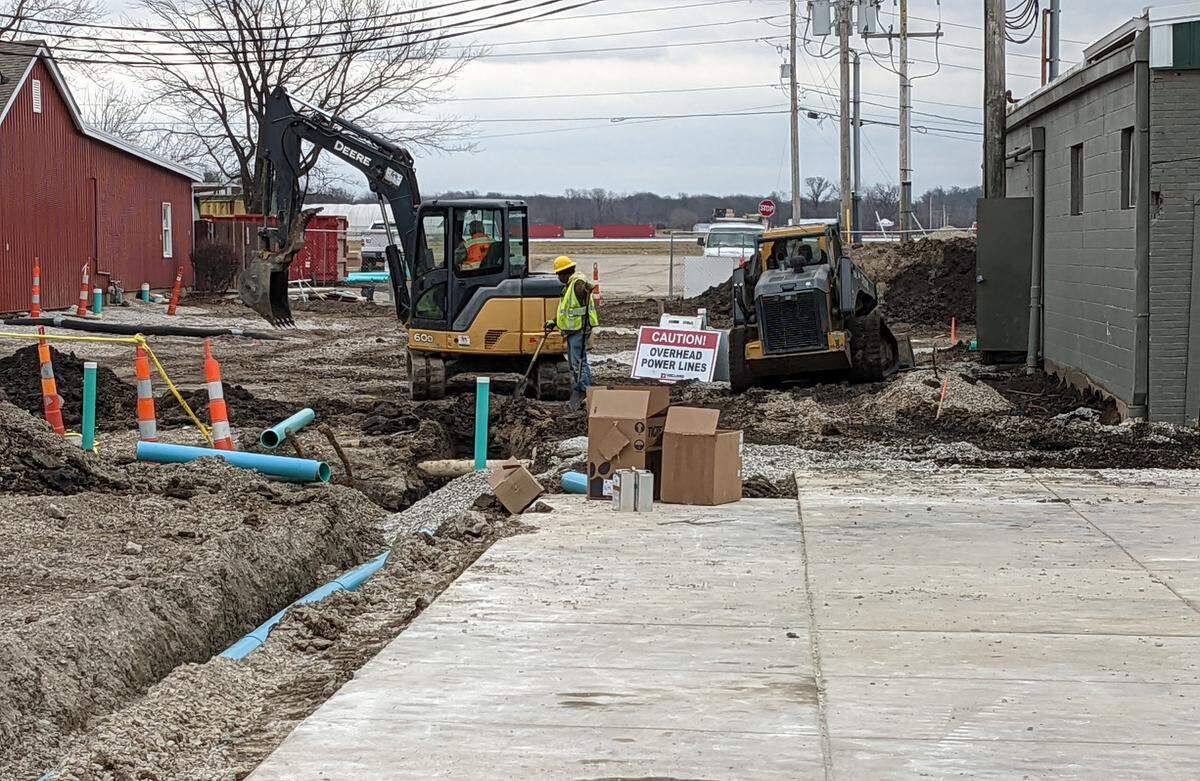 The crew digs trenches to lay new utility lines at Eckert’s Belleville Farm.