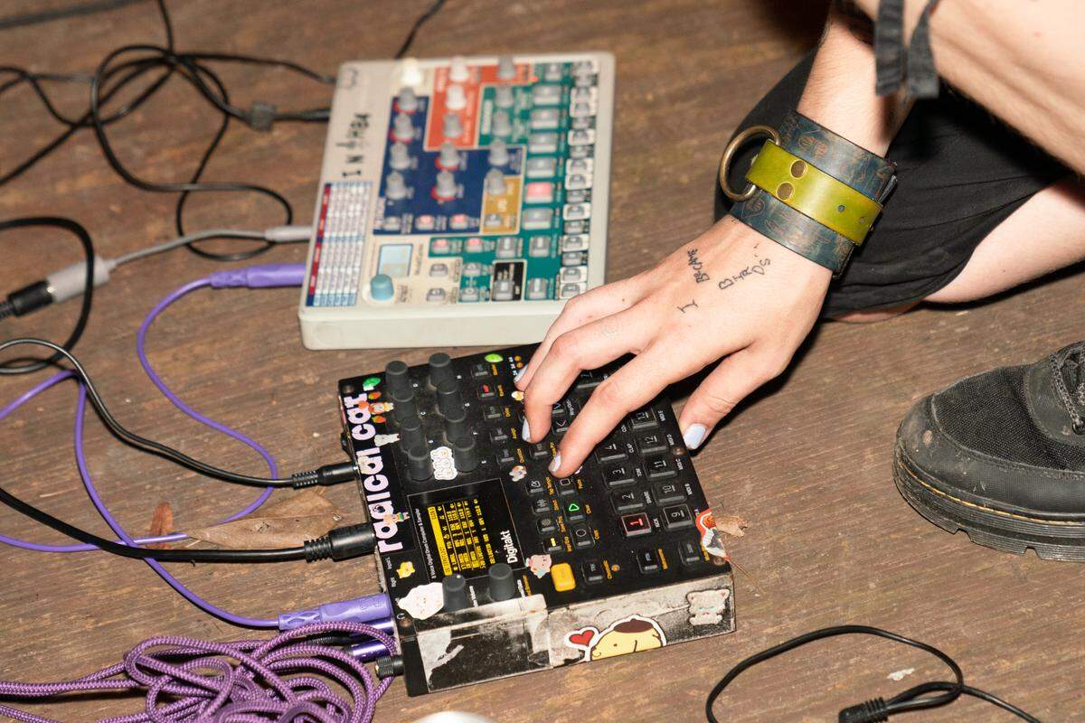 An artist adjusts their sound levels during a Thursday night performance at The Nunnery.