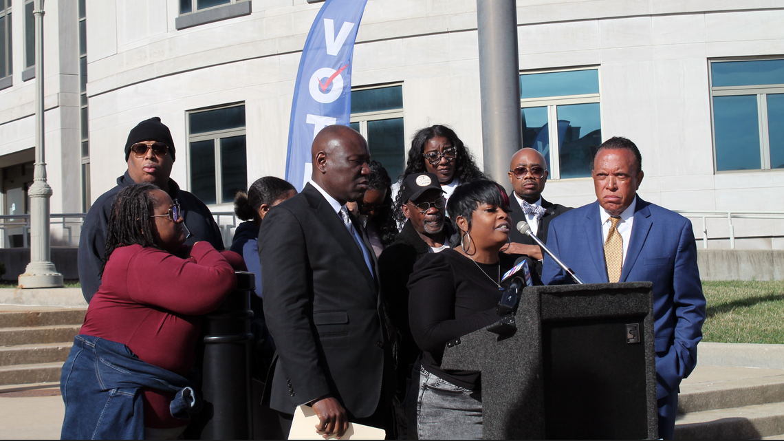 LaToya Simmons, of St. Louis, speaks about her brother Zareef M. Fawaz’s death at the Madison County Jail during a news conference Tuesday in front of the Madison County Courthouse surrounded by other family members and their attorneys.
