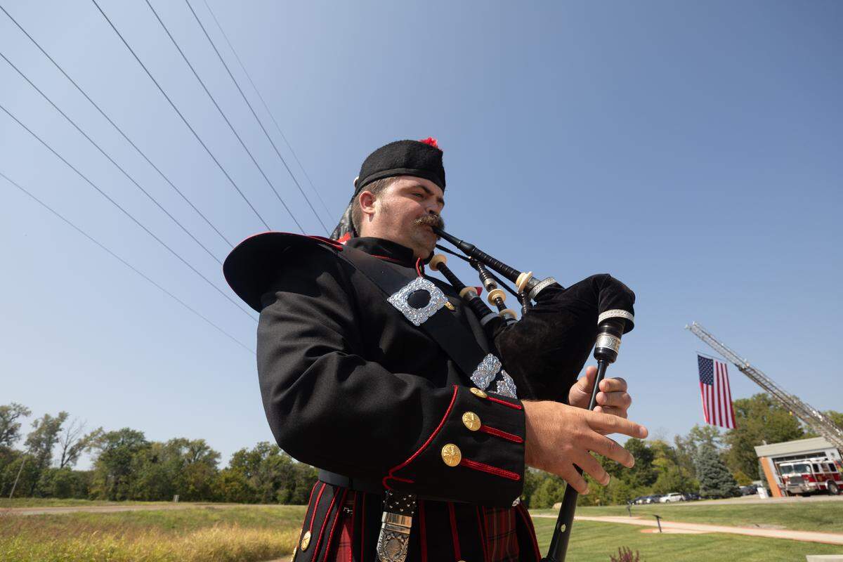 Belleville Firefighters Pipers & Drums performs “Amazing Grace” during the retirement of the colors following a commemorative ceremony for victims of 9/11.