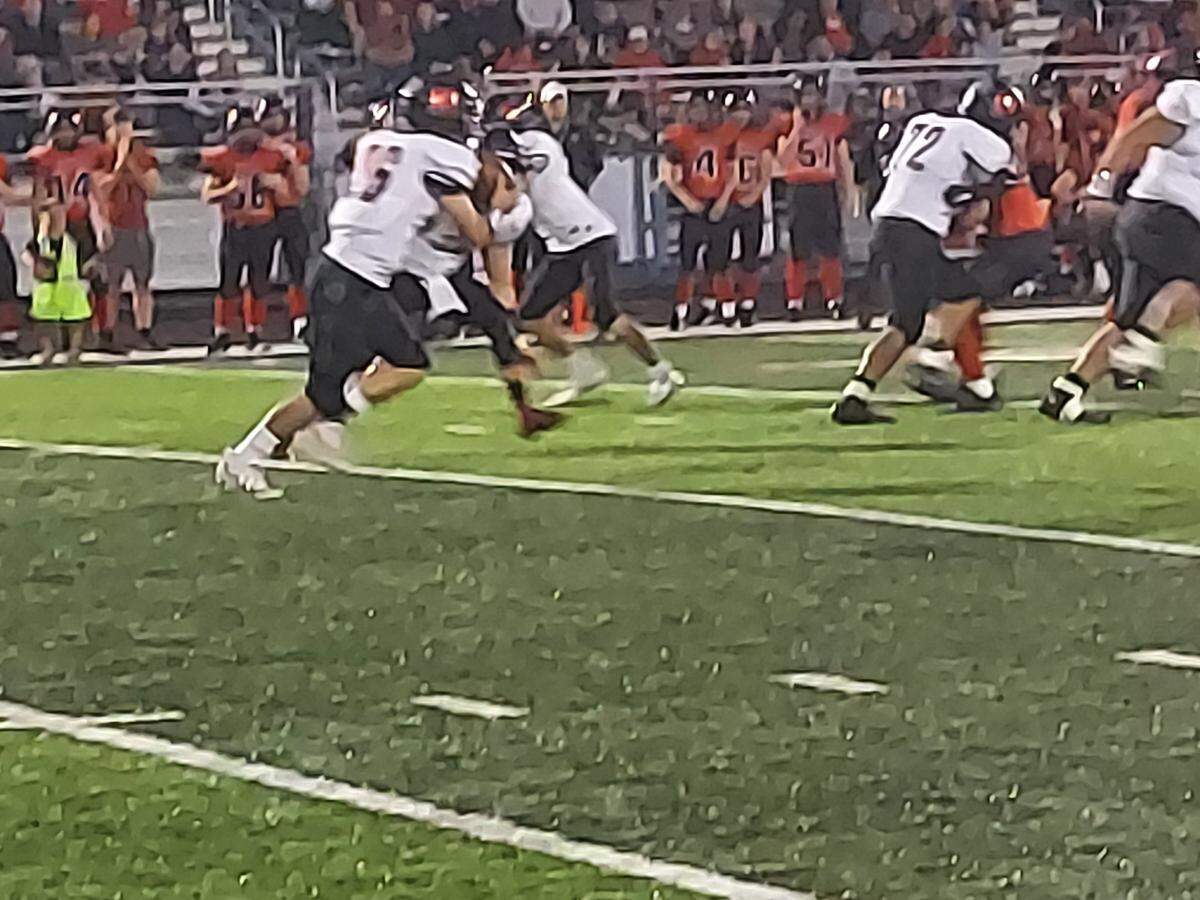Highland High School’s Travis Porter heads upfield on a run against Triad last season. Porter is the winner of the season opening Belleville News-Democrat Football Player of the Week high school basketball poll, as selected by readers of bnd.com.
