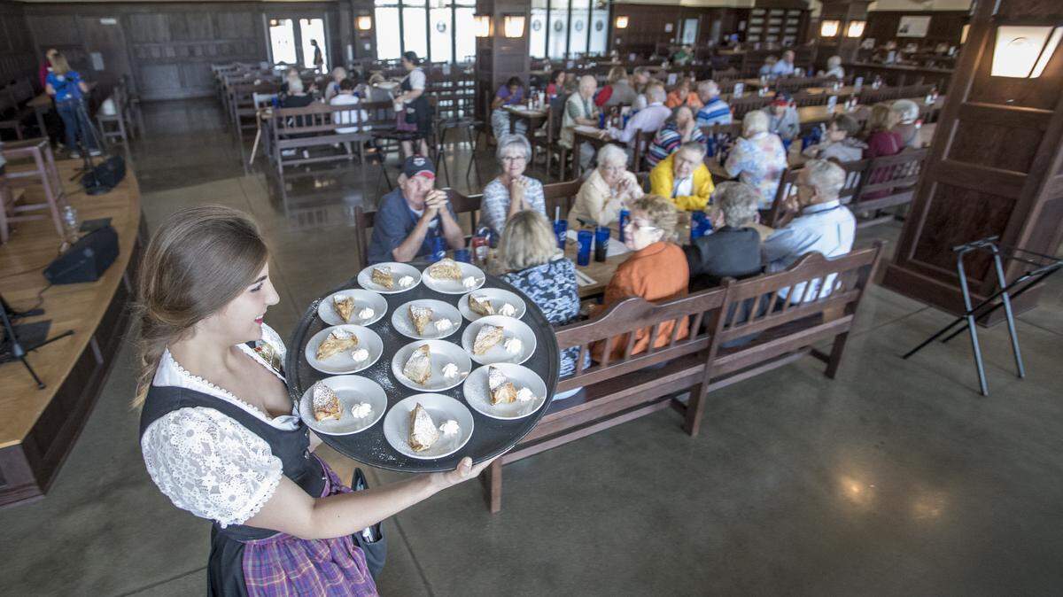 A Belleville Hofbräuhaus waitress brings out dessert for a Missouri tour group having lunch during a Belleville tourism event in this 2019 file photo.