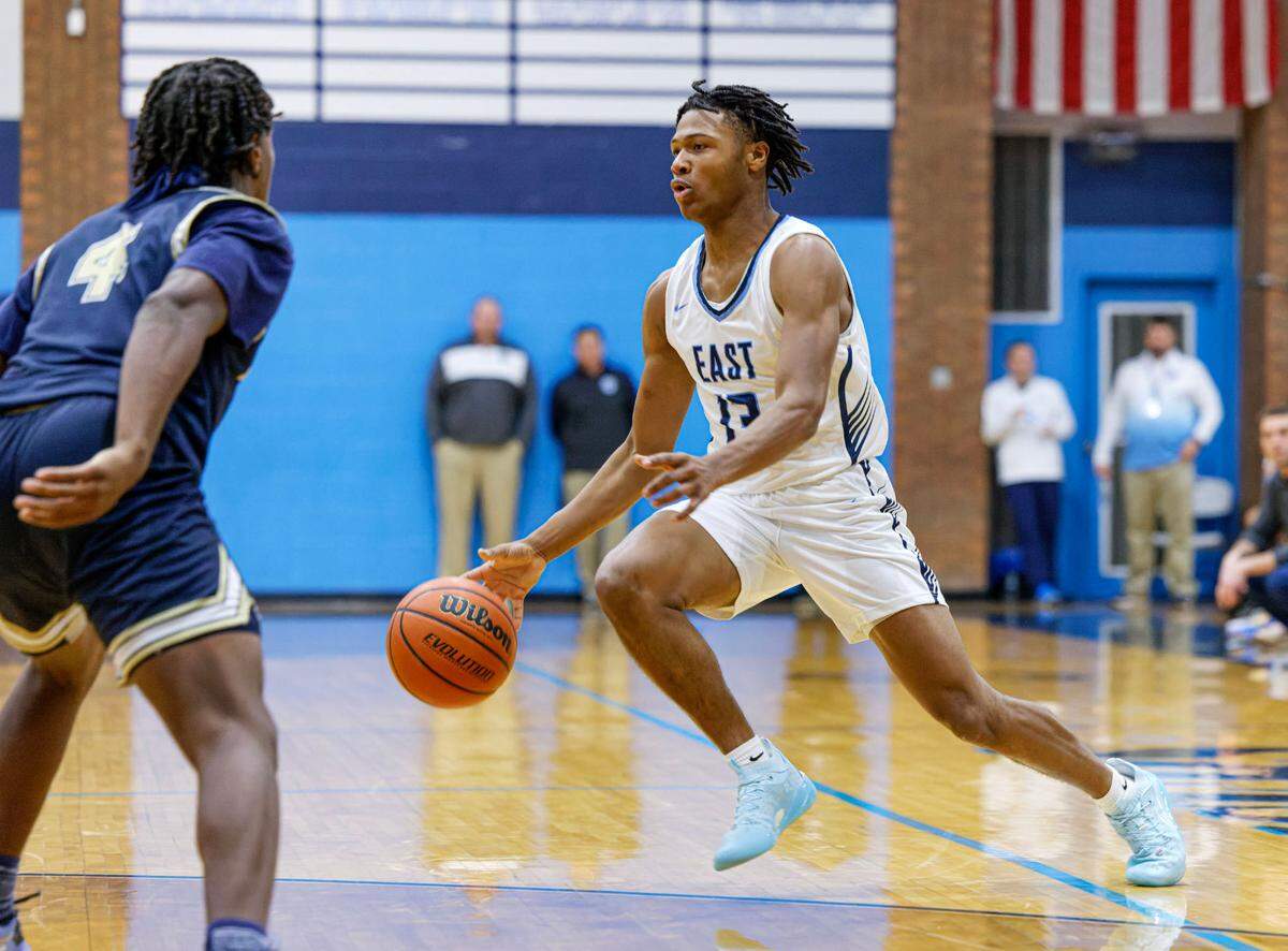 Belleville East’s Jackson Muse moves the ball during Tuesday’s non-conference game against Althoff. The Lancers ultimately posted a 78-50 victory.