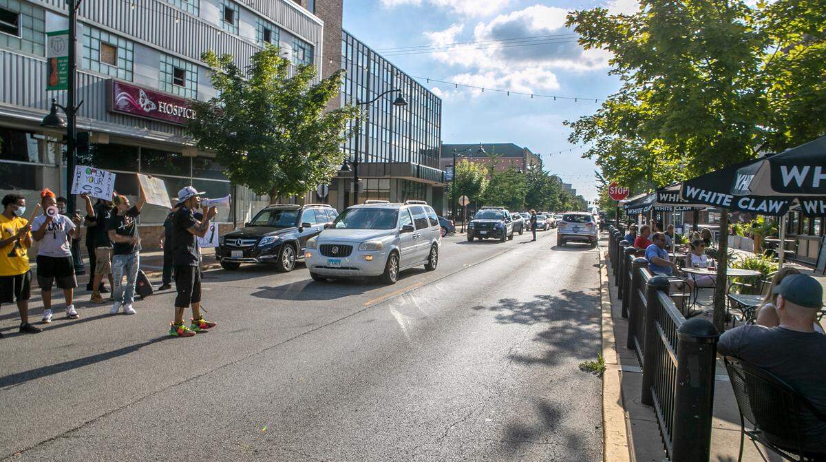 Empire Comfort Systems employees and other Black Lives Matter protesters stopped in front of Tavern on Main in downtown Belleville early Friday evening, and co-organizer J.D. Dixon spoke directly to customers eating outside.