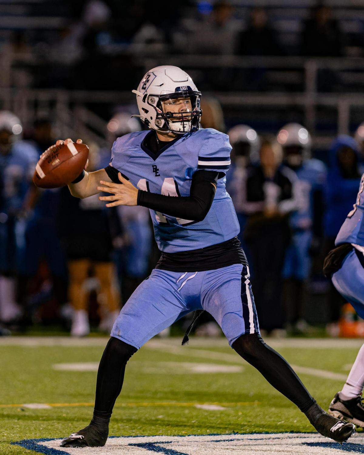 October 18, 2024 - Belleville IL, Belleville East Kayden Wood looks downfield for an open receiver during FridayÕs Southwestern Conference matchup between Belleville East and Belleville West [Photo: Jimmy Simmons]