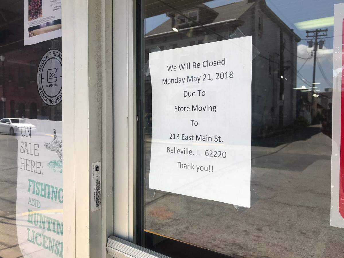 A sign on the front door at Curt Smith's Outdoors Shop says the store plans to move.
