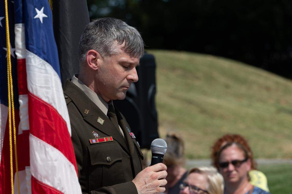 Colonel Steven Puthoff, Deputy Chief of Staff for Operations, G3, Scott Air Force Base speaks during a 9/11 remembrance ceremony along the 9/11 Memorial Walkway at Belleville firehouse #4.