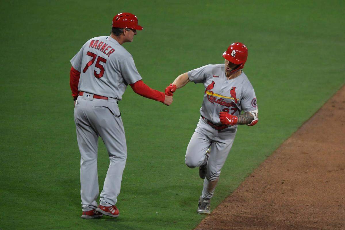 St. Louis Cardinals’ slugger Tyler O’Neill (27) is congratulated by third base coach Ron Warner after hitting a two-run home run against the San Diego Padres earlier this season. O’Neill and his teammates hope the upcoming All-Star Break will serve as a reset to the season as St. Louis enters the second half well off the pace to make the postseason.