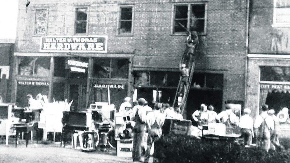 The O’Fallon Fire Department fights a fire at Thomas Hardware in 1928.