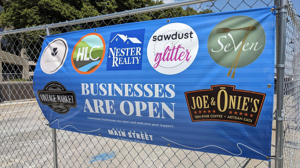 Banners posted on the barricades around downtown Belleville’s Public Square let customers know the businesses are open.