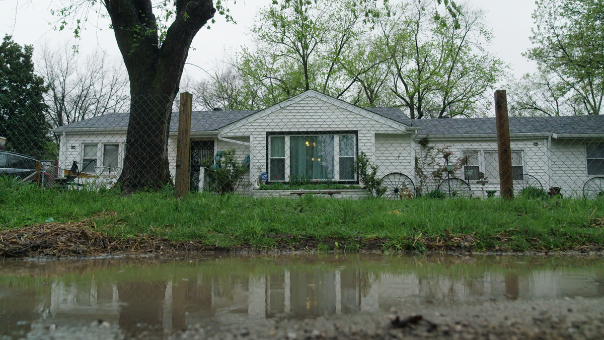 Water rises in the streets outside Patricia Greenwood’s house in the Piat Place neighborhood.