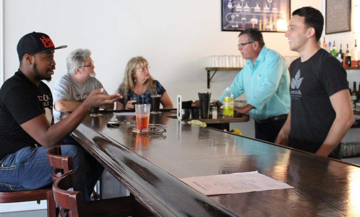 Customers at Clancy’s Brewery in Granite City include, from left, Ted Witherspoon, Dwain Page and Pam Wolf, who are visiting with Director of Operations Walt Chaboude and Manager Ryan Cassens.