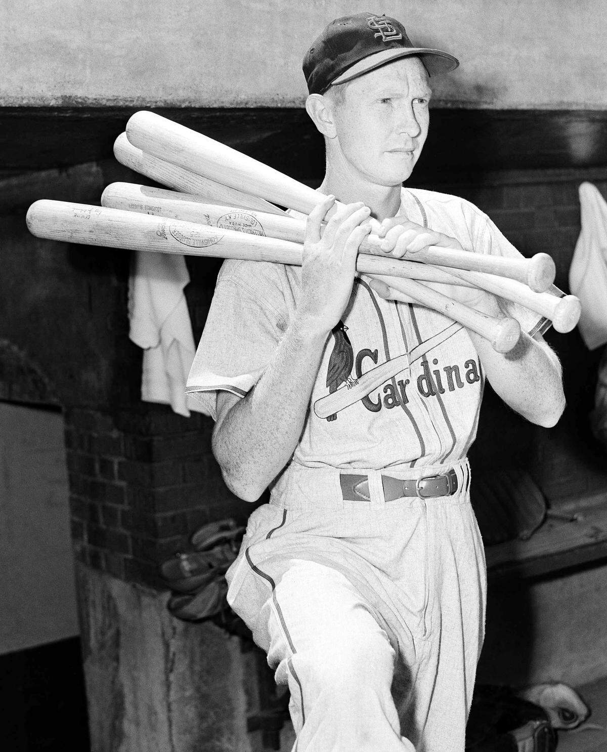Red Schoendienst looks out from the dugout at Wrigley Field in Chicago before a game with the Chicago Cubs on July 3, 1953. (AP Photo)