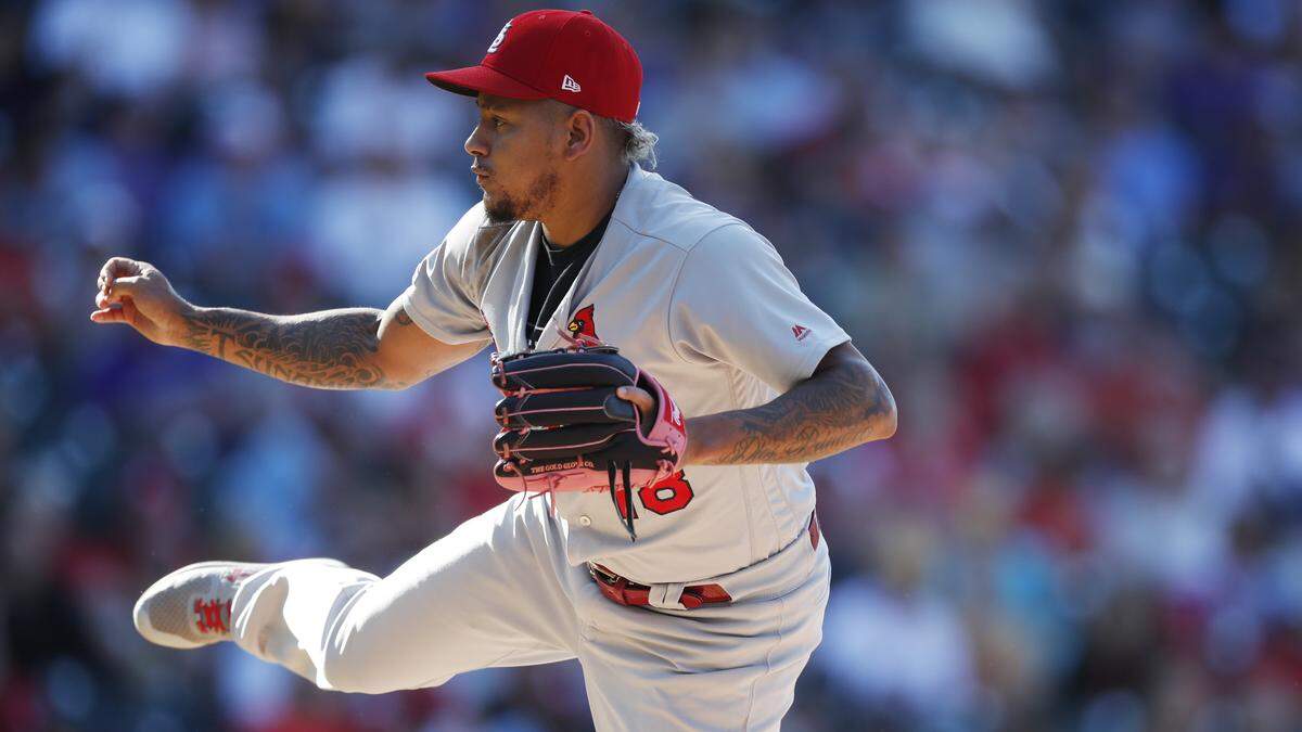 St. Louis Cardinals relief pitcher Carlos Martinez (18) in the eighth inning of a baseball game Thursday, Sept. 12, 2019, in Denver. (AP Photo/David Zalubowski)
