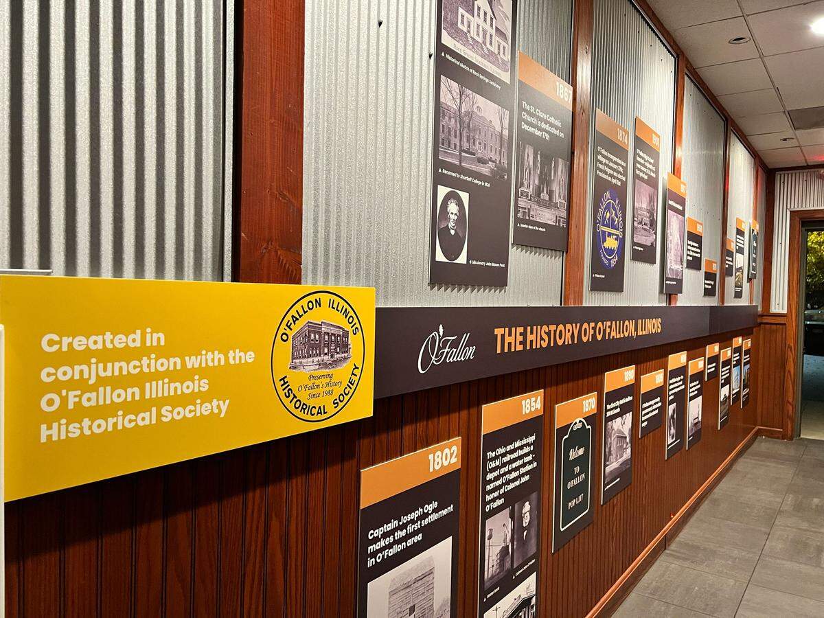 A wall display at the OTown Food Hall & Tap Room features the history of O’Fallon in a visual timeline, a joint venture with the O’Fallon Historical Society. Brian Keller, OHS president, and Jessica Short contributed. This Saturday, Jan. 28, the local historian, icon and official photographer of all things O’Fallon is being celebrated with Brian Keller Day.