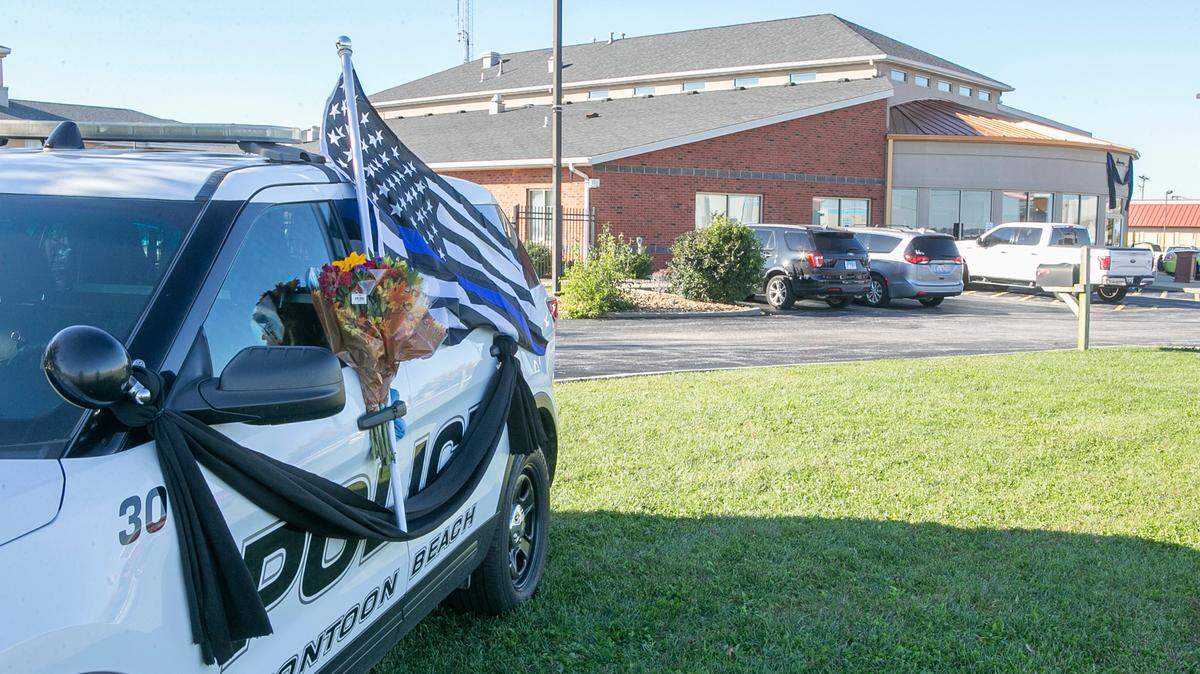 A memorial for the Pontoon Beach, Illinois police officer, Tyler Timmins, is located outside the department. Timmins died after being shot at gas station, he was investigating what he suspected to be a stolen vehicle at the Speedway gas station at the intersection of Illinois 111 and Interstate 270.