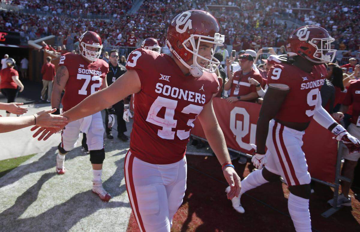 Oklahoma place kicker Austin Seibert walks onto the field before an NCAA college football game between Kansas State and Oklahoma in Norman, Okla., Oct. 27, 2018. The Belleville West graduate scored a personal best 15 points in that game and, the next week, established a new NCAA record for career PATs.