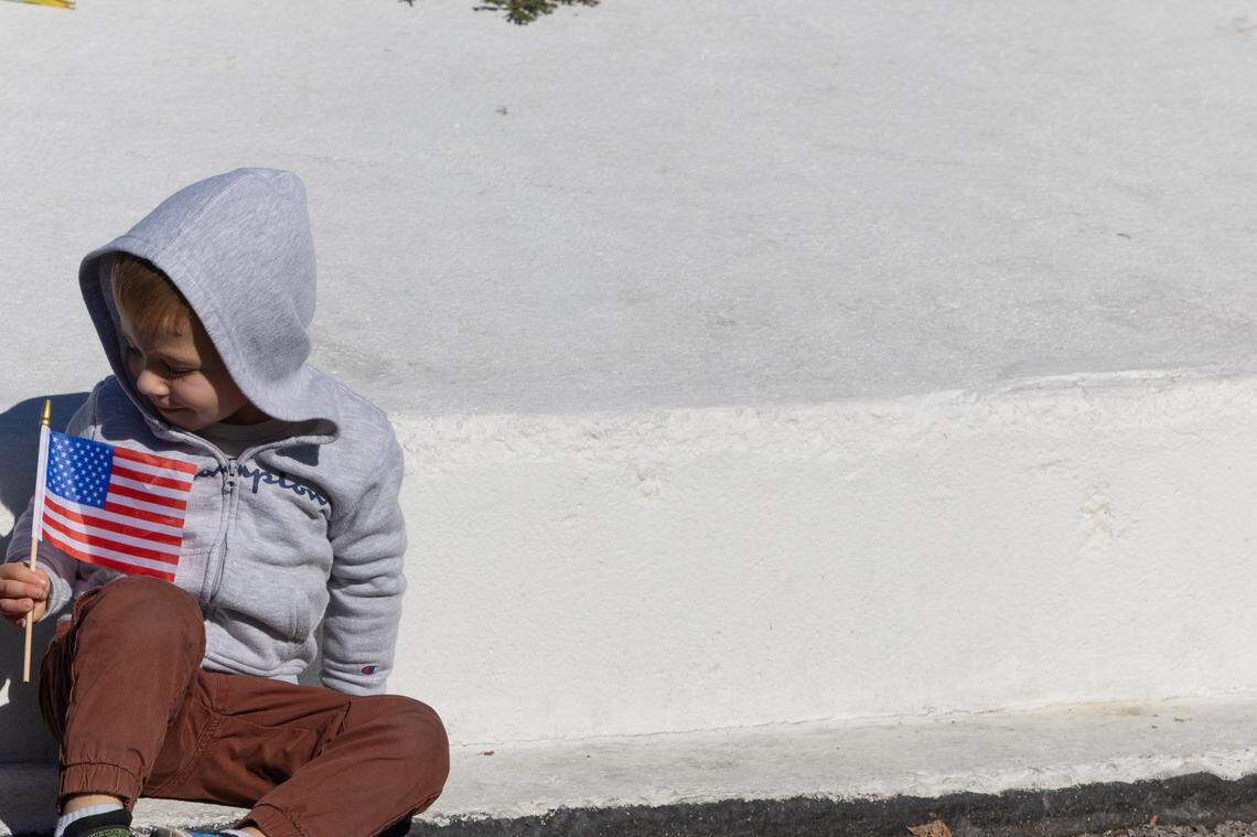 A child holds a flag during Belleville’s 26th annual Veterans Day ceremony on Nov. 11, 2024.