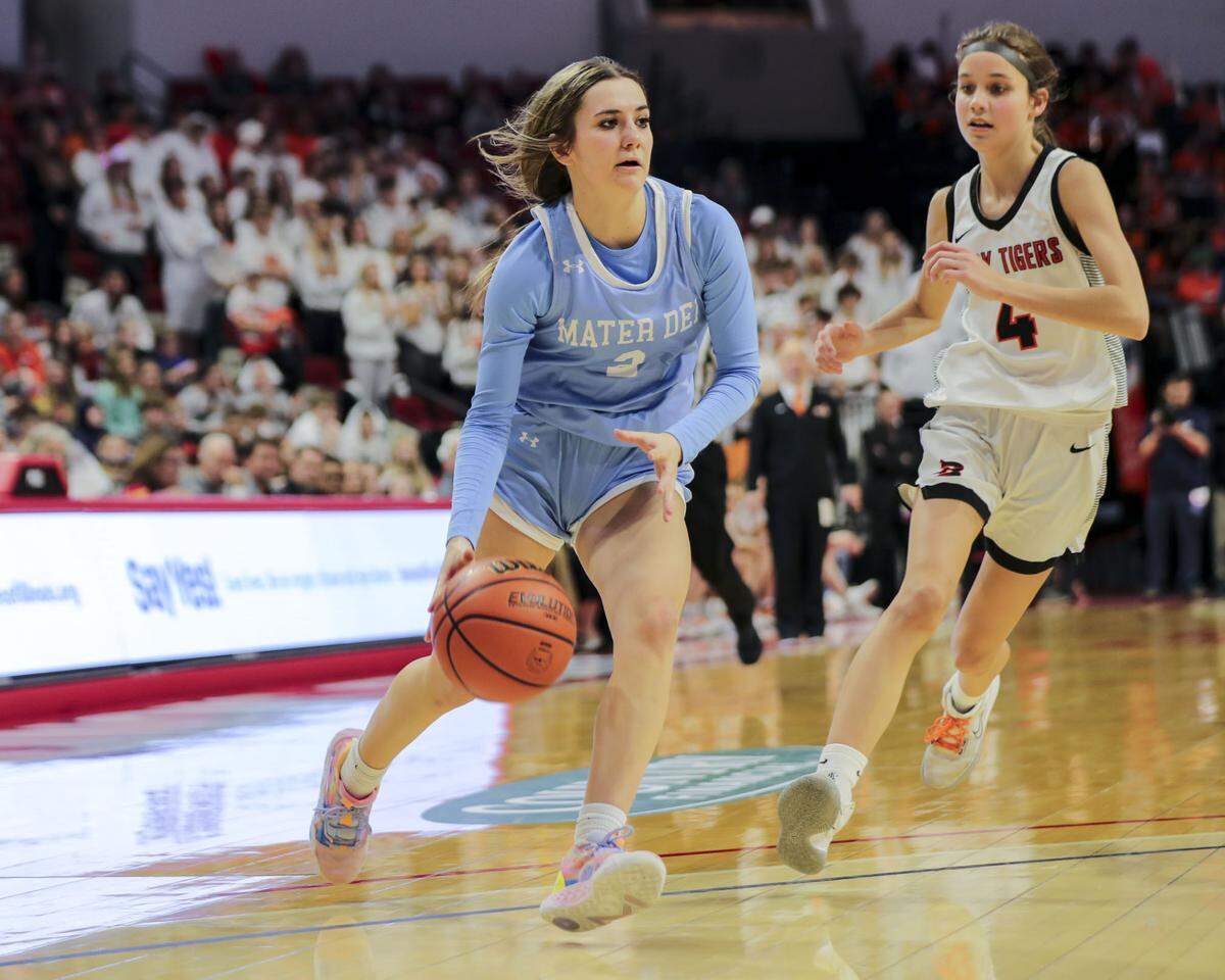 Mater Dei’s Avery Trame drives to the basket during Saturday’s IHSA Class 2A state championship game at CEFCU Arena (formerly Redbird Arena) on the campus of Illinois State University. Mater Dei ultimately prevailed 62-46 to claim the state title.