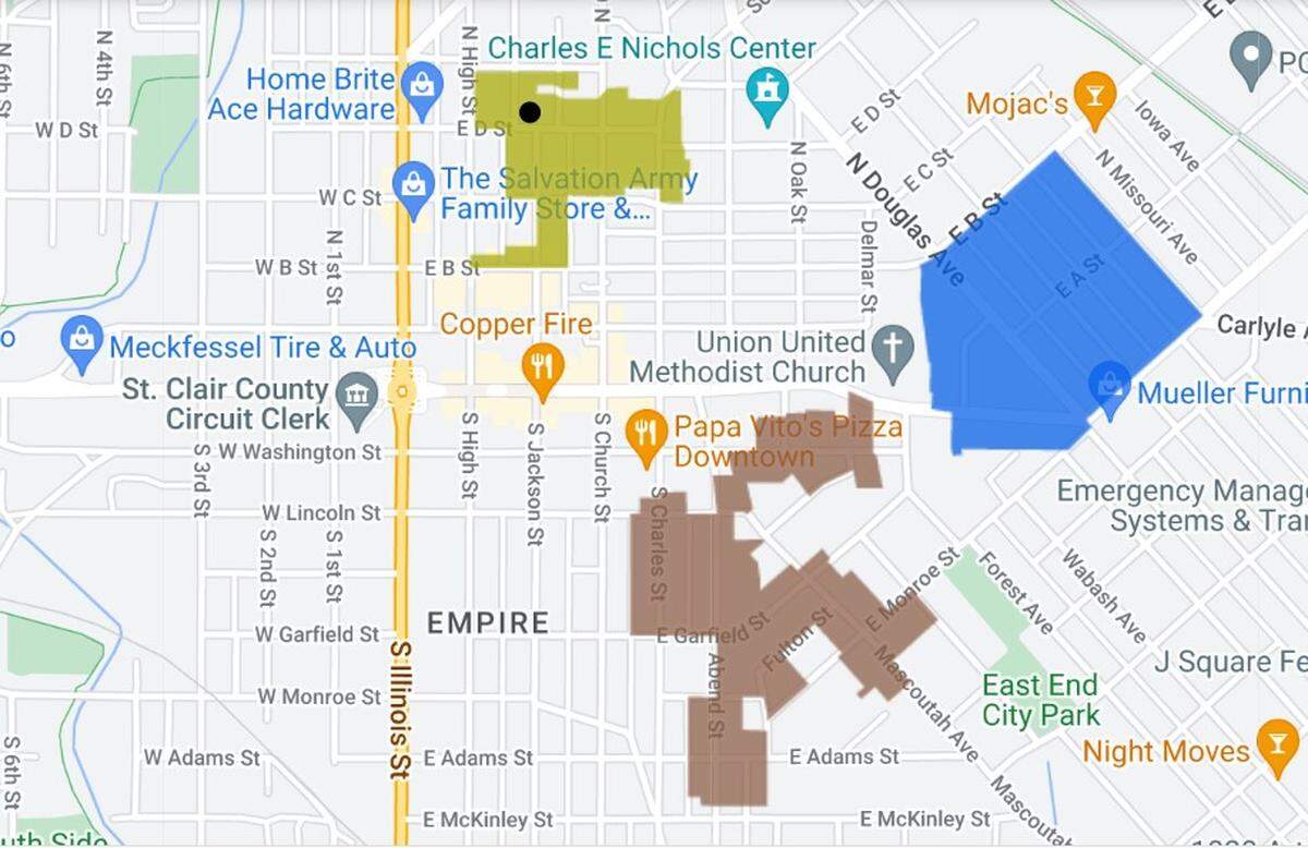 A black dot shows where the city of Belleville plans to demolish a home at 107 E. D St. The green, blue and brown shaded areas are historic districts.
