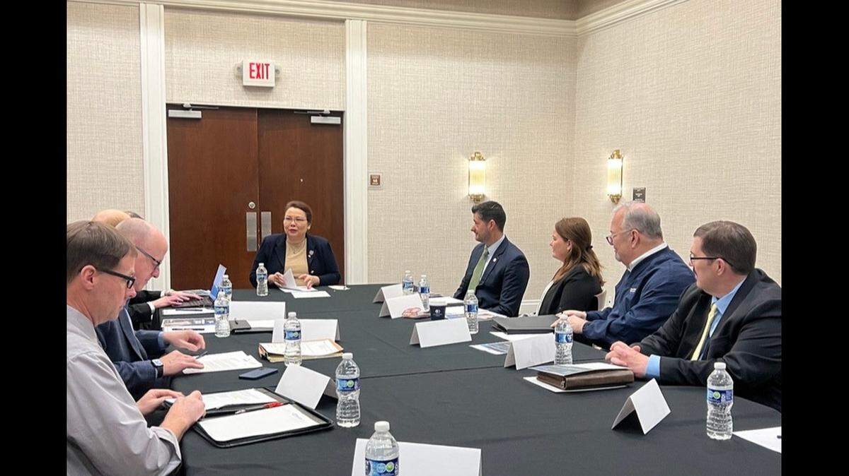 Sen. Tammy Duckworth, center, meets with representatives of regional Illinois airports on Saturday in Collinsville.