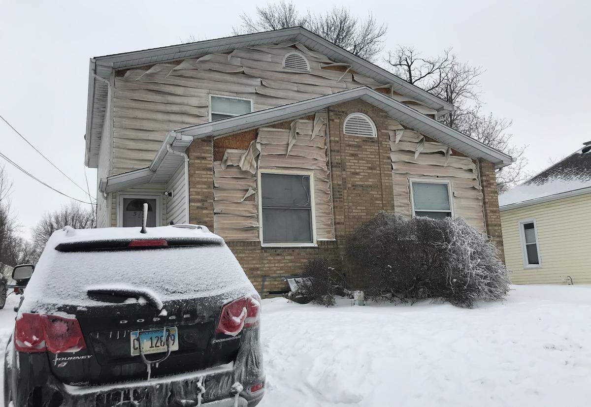 Strong winds blew flames and heat from a fire that destroyed an R.P. Lumber Co. outbuilding in Edwardsville on Monday, breaking windows and melting siding on homes across the street.