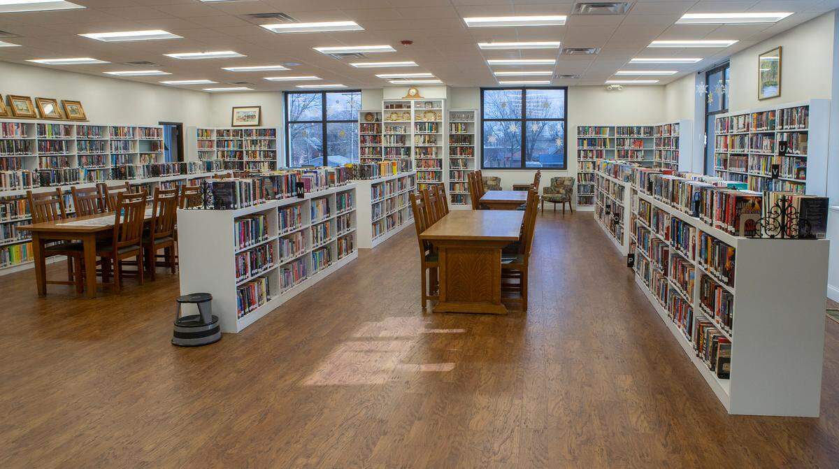 After photo of the main collection with new flooring, painted shelving and repaired walls at the Louis Latzer Public Library in Highland.