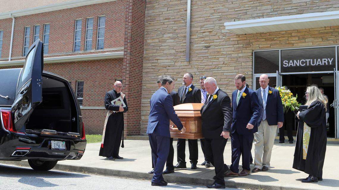 Mark Eckert’s sons and other family members serve as pallbearers, carrying the casket of the former Belleville mayor after his funeral service on Monday at St. Paul United Church of Christ in Belleville.
