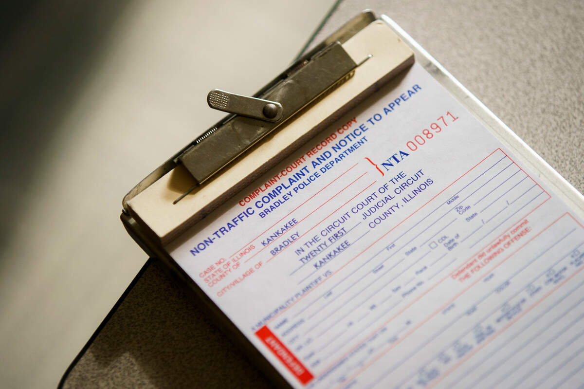 A ticket book on the desk of school resource officer Roger Tambling at Bradley-Bourbonnais Community High School.