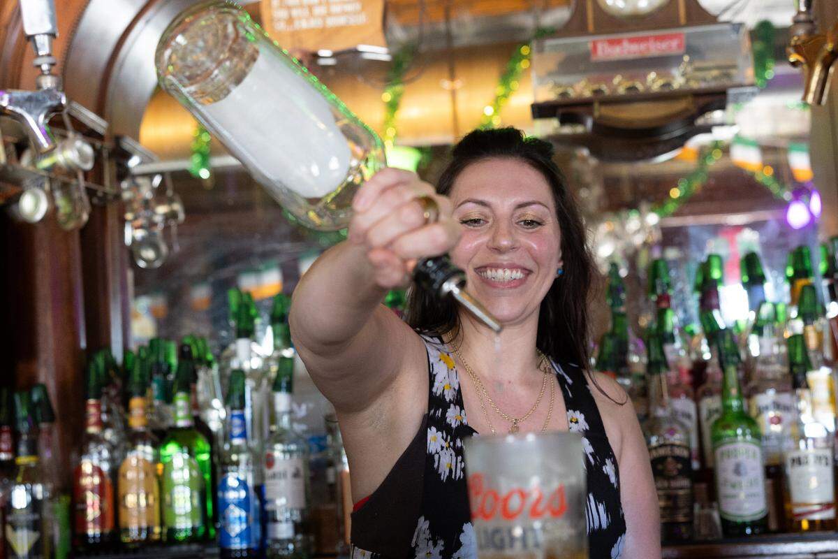 Natalie Turner pours a drink at Sullivan’s