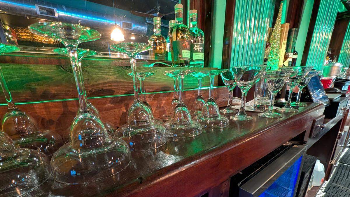Cocktail glasses unpacked and washed at The Harp Pub prior to opening