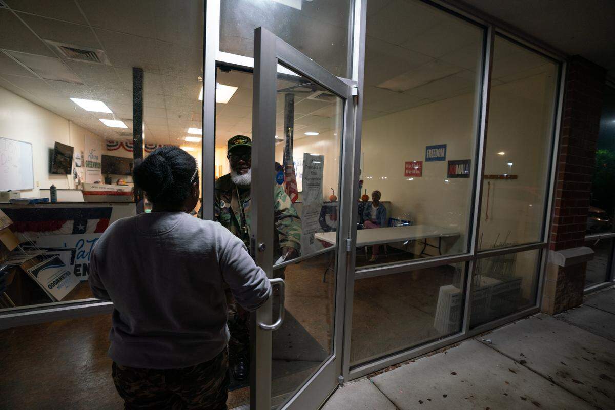 A statistician brings a vote count to LaToya Greenwood’s campaign headquarters from across the way, where a watch party full of her supporters eagerly awaited results from a close race against incumbent Kevin Schmidt.