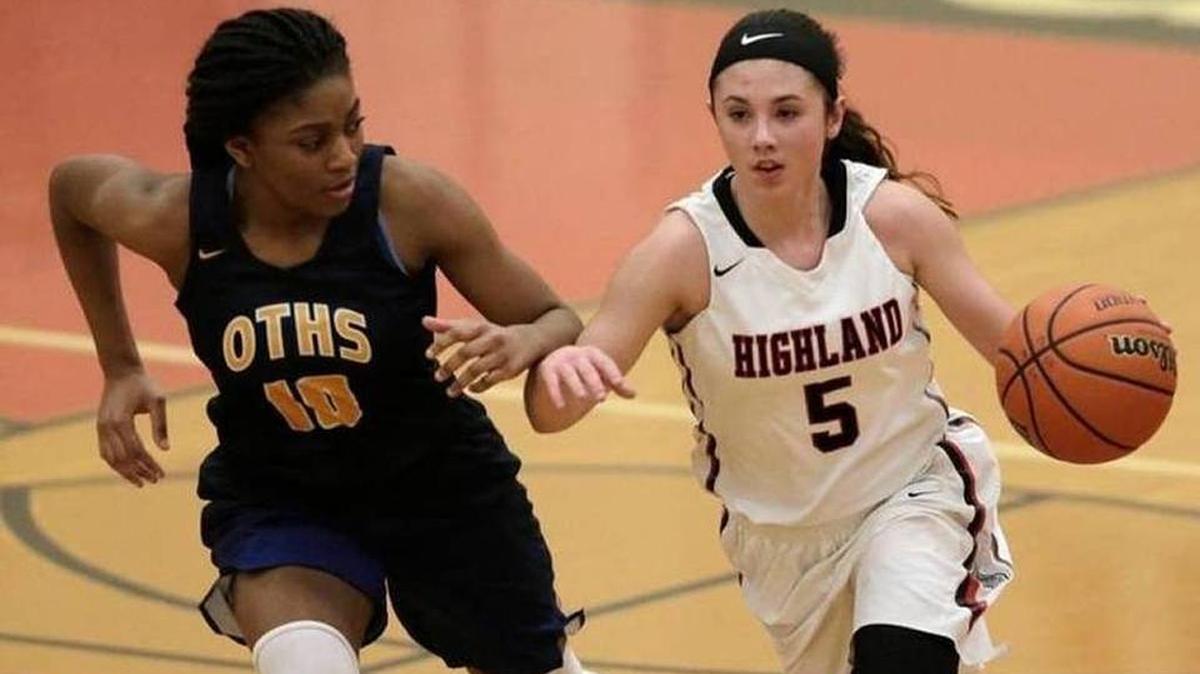 Highland’s Ellie Brown (right) tried to maneuver around O’Fallon’s Jayla Stubblefield in a game during the 2017-2018 season.