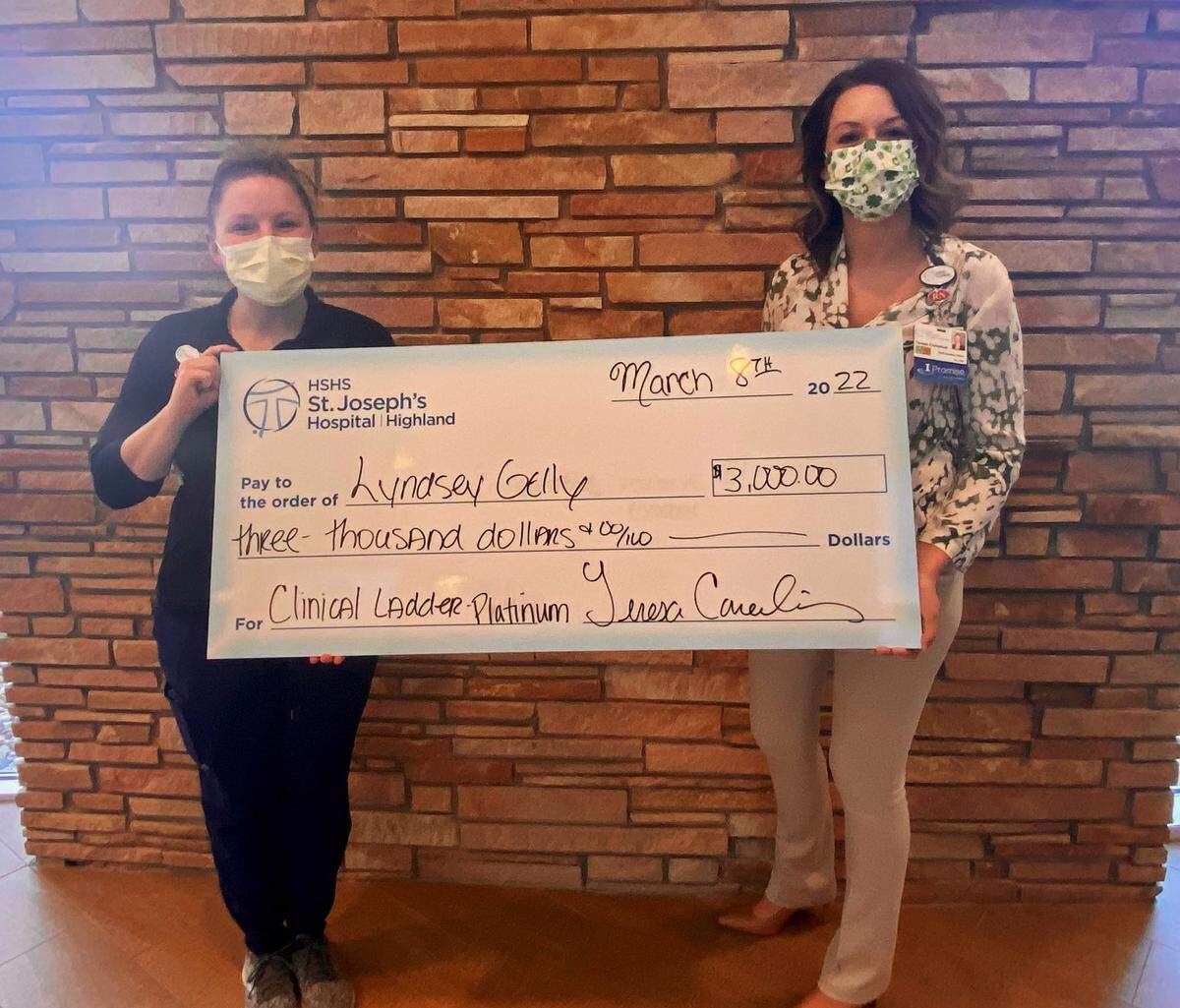 From left, Lyndsey Gelly, RN, HSHS St. Joseph’s Hospital Highland, received the Platinum Level award in the hospital’s Nursing Clinical Ladder program and is recognized by Teresa Cornelius, chief nursing officer. The NCL program is funded by the HSHS St. Joseph’s Foundation.