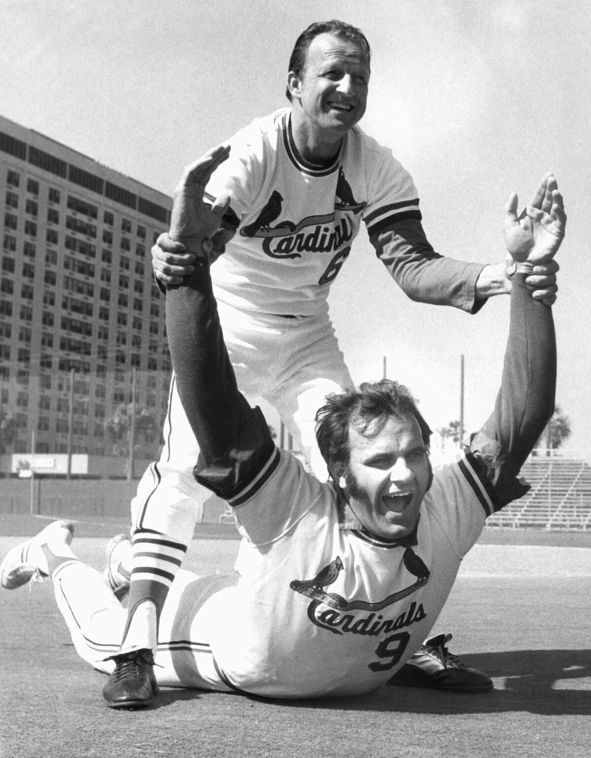 St. Louis Cardinals Joe Torre has Stan Musial, Cardinals vice President as calisthenics mate for Torre?s first workout on March 10, 1972 in St. Petersburg, Florida since accepting a two-year contract of $280,000. Torre was the American League?s Most valuable Player last year. (AP Photo/Harry Harris)