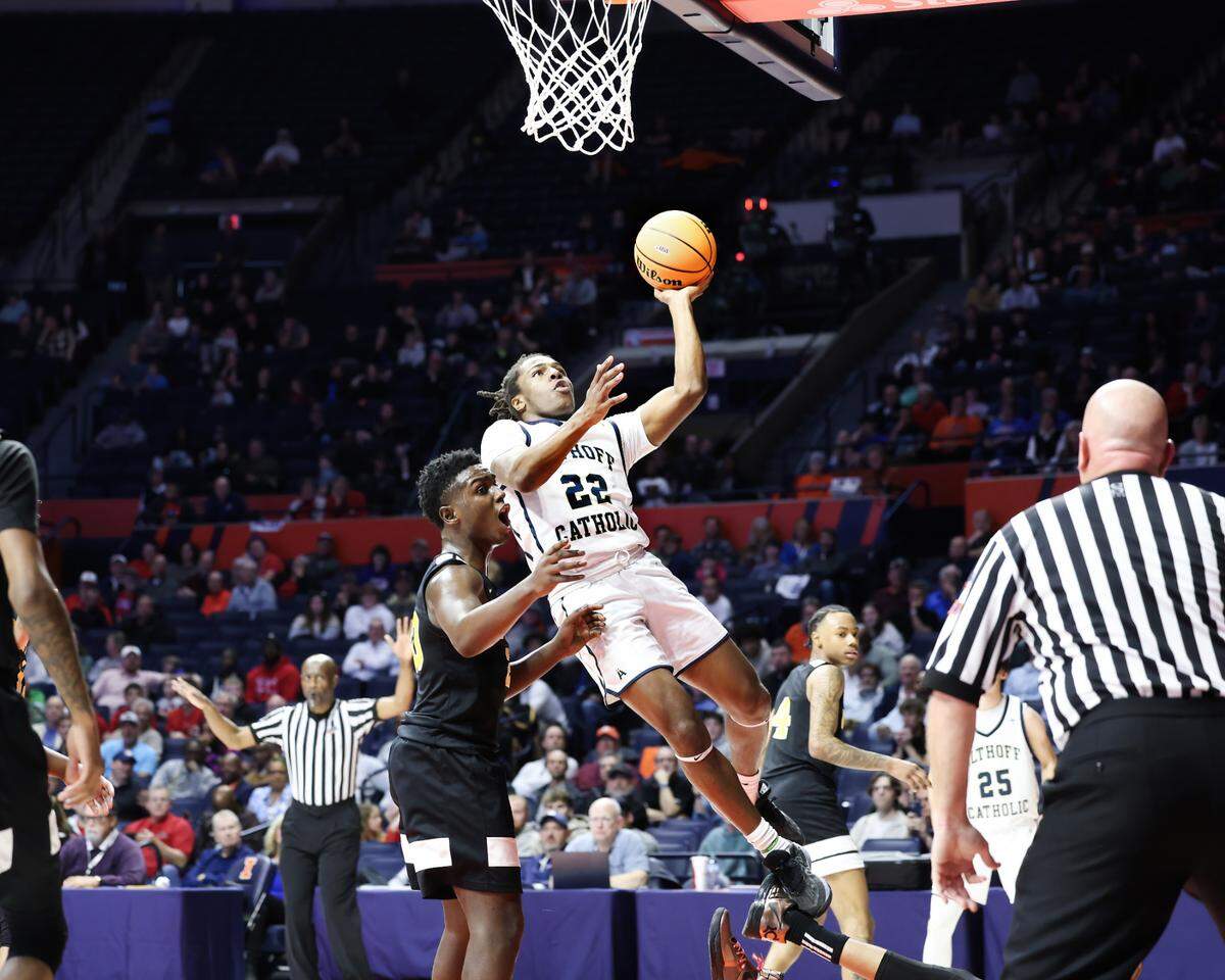 March 15, 2025 - , - Belleville Althoff’s Dierre Hill Jr. draws his fifth foul (charging} during the IHSA, 2A championship game against Chicago (Dyett) at the State Farm Center in Champaign. [Photo: Chris Johns]
